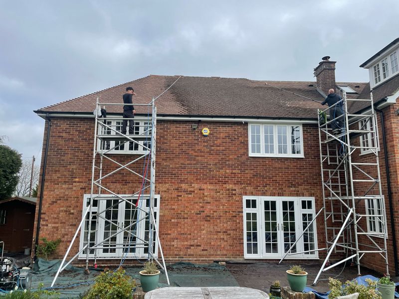 Roof cleaning carried out safely from scaffold towers by The Roof Moss Cleaners in Southwick